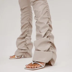 stone coloured ruched side trousers with strappy silver heels