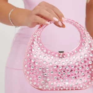 pink crescent shaped clutch baf with diamante details