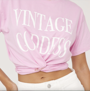 pink cropped t shirt with white goddess print